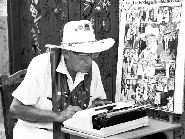 Man outside the Bodeguita del Medio Bar (where Mojito was first invented)